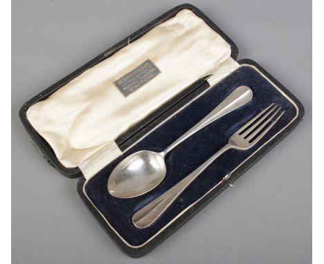 A cased silver spoon and fork. Assayed Sheffield 1918 by James Dixon &amp; Sons Ltd. 60g  