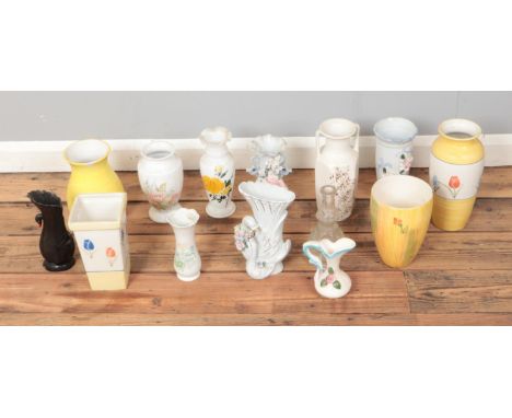 A box of assorted ceramic and glass vases to include floral and novelty swan examples.  