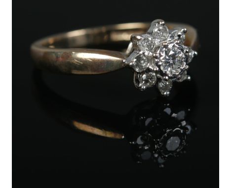 A 9ct Gold diamond cluster ring. Size N. Total weight: 3.1g  Central stone 1/8ct.