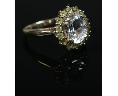 A9ct Gold topaz and tsavorite garnet halo ring. Size N. Total weight: 3.9g  