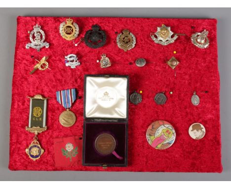 A display tray of badges and medals, to include Army and Royal Engineers examples.  