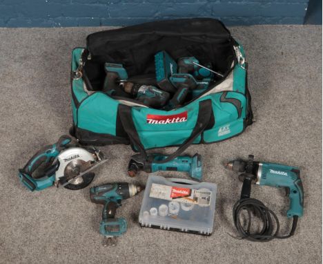 A large bag of Makita tools including cordless drills, drill bits, saw, battery packs, etc.  Not tested.