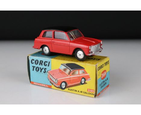 Boxed Corgi 216M Mechanical Austin A40 Saloon diecast model in red body, black roof, with flat spun wheels, box gd with minim