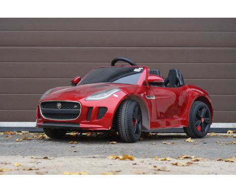 Contemporary battery powered Jaguar F Type childs ride on car, with r/c, charger and instructions 