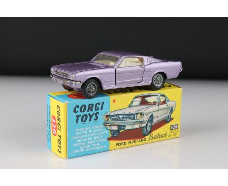 Boxed Corgi 320 Ford Mustang Fastback 2+2 diecast model in metallic purple, diecast excellent, box vg with Corgi paperwork 