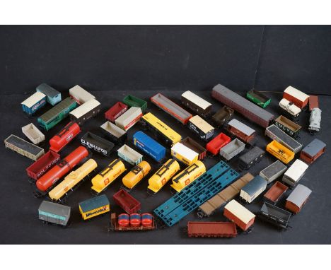 Around 55 OO gauge items of rolling stock to include wagons, tankers, flatbeds and trucks featuring Hornby, Lima, Mainline et