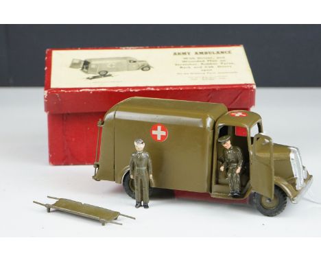 Boxed Britains 1512 Army Ambulance military diecast model with driver, stretcher and wounded man figure, vg condition with gd