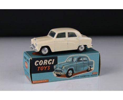 Boxed Corgi 201M Mechanical Austin Cambridge Saloon diecast model in cream, with Corgi brochure, diecast with some paint mark