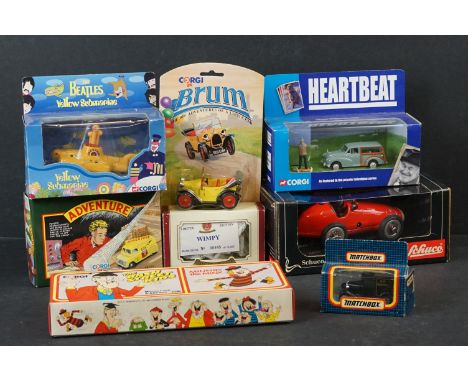 Eight boxed diecast / tin plate models to include Schuco Classic Grand Prix Racer 1070, Corgi The Beatles Yellow Submarine CC