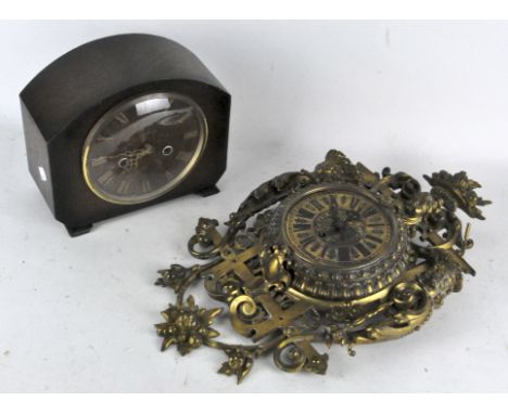 An ornate brass wall clock, the dial with Roman numerals denoting hours, 47cm high; together with a Smith's mantel clock