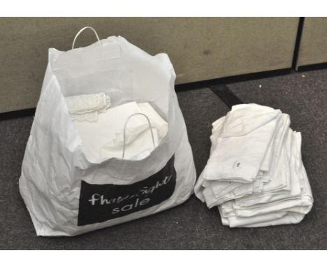 A bag of assorted vintage linen, some having floral design