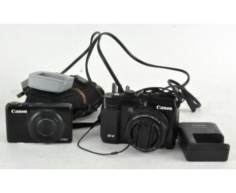 A Canon G1X Power shot camera and Canon S120