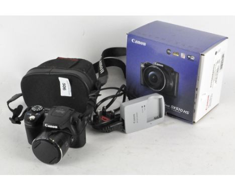 A Canon Powershot 5X510 HS digital camera, in box