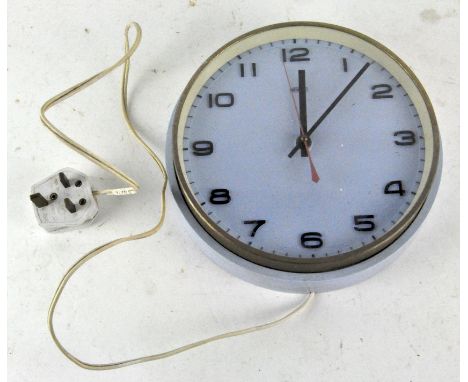 A vintage Metamec wall clock, light blue in colour, with Arabic numerals denoting hours, 22cm diameter
