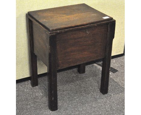 A vintage oak stained sewing box, 54cm high x 43cm wide x 35cm deep