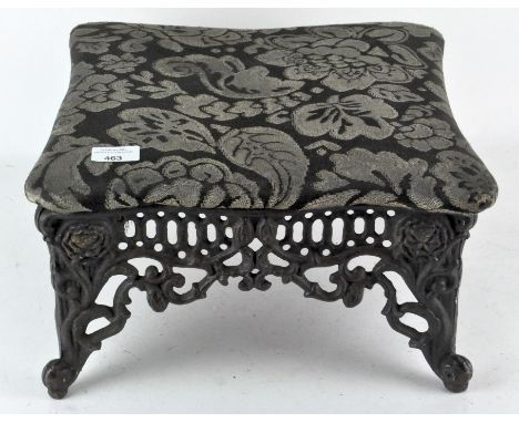A vintage cast metal footstool, with upholstered top, 20cm high x 37cm wide x 37cm deep