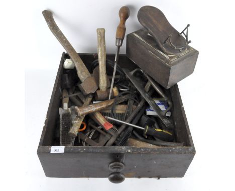 A tray containing a variety of vintage tools, including a mallet, axe, screwdrivers and more