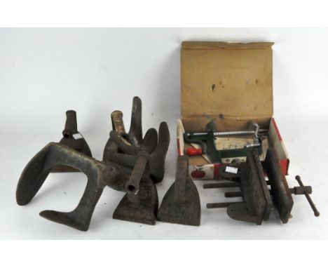 A group of mixed metalware, including iron door stops, a vice, irons 