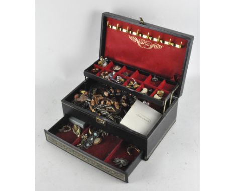 A vintage jewellery  box, containing a variety of costume jewellery, including clip-on earrings, rings and brooches