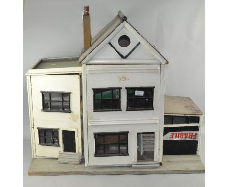 A vintage two storey dolls house, 68cm high x 78cm wide