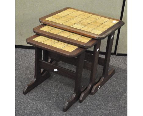 A mid-century teak tile top nest of tables, 44cm high x 50cm wide x 44cm deep