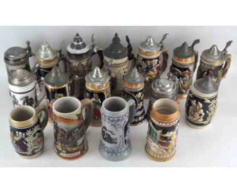 A collection of German ceramic Steins, of various shapes and sizes, tallest 22cm high