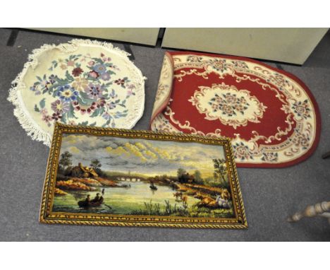 Three vintage rugs, to include an oval rug with red ground, 185cm x 121cm; a round floral rug, 102cm diameter; and a rug with