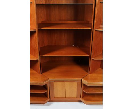A G-plan modular unit, circa 1980, retailed by E Gomme, of canted rectangular section, on triangular base, with a top unit wi
