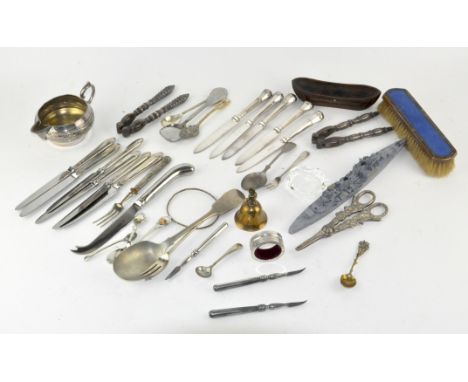 A mixed collection of silver plated items, mostly flatware, including nut crackers