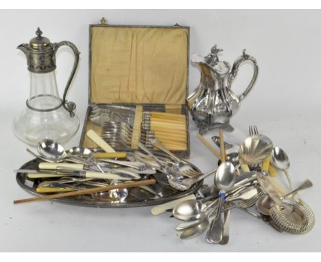 A collection of silver plated items, including a late 19th century glass silver plated claret jug and flatware