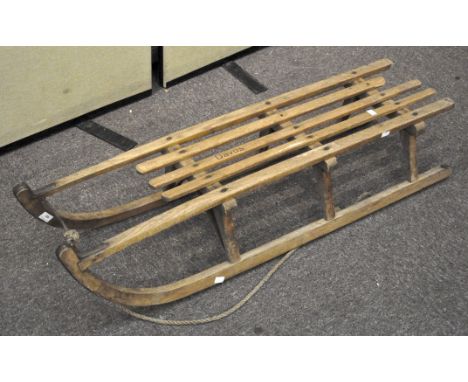 A vintage 'Davos' wooden sledge/sleigh, 114cm long