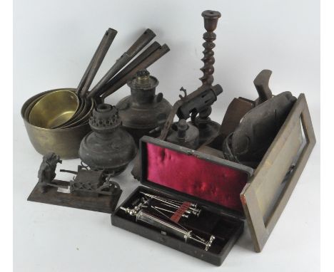 A collection of assorted items, including vintage blow torch, brass graduating saucepans, a wood block plane and other items