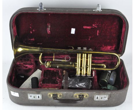 A vintage 'Melody Maker' trumpet, 48cm long, in original fitted case (A/F)