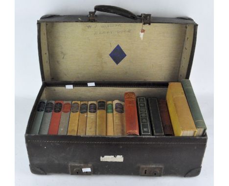 A vintage 'Revelation' leather suitcase/travelling case,along with a collection of books, mostly published by 'The Companion 