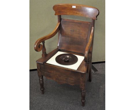 A Victorian mahogany commode chair with scrolled arm rests, 95cm high x 58cm wide x 53cm deep
