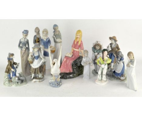 A collection of Lladro style figures, including 3 Nao figures