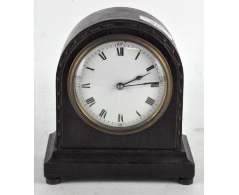 A small French oak cased mantel clock, the enamel dial with Roman numerals denoting hours, 16cm high