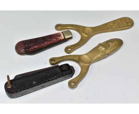 A GROUP OF POCKET KNIVES AND CATAPULTS, comprising a George Wostenholm pocket knife with antler scales, blade marked 'I.XL Ge