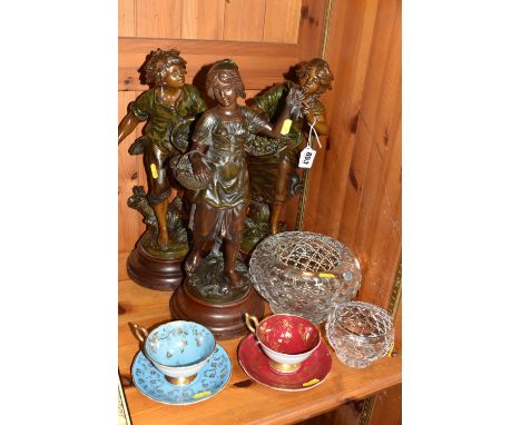 A GROUP OF DECORATIVE ITEMS to include three French spelter figures on wooden circular bases comprising two after Francois Mo