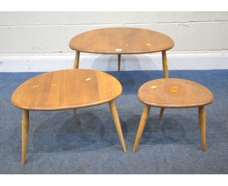 LUCIAN ERCOLANI, AN ERCOL MID CENTURY ELM AND BEECH PEBBLE NEST OF THREE TABLES, raised on cylindrical tapered legs, model nu