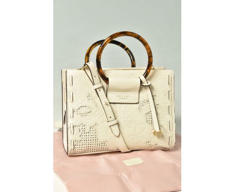 RADLEY: a cream leather grab bag with removable cross body strap, two circular faux tortoise shell handles and a gold tone Sc