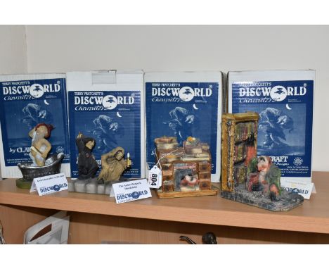 A GROUP OF FOUR BOXED CLARECRAFT DISCWORLD COLLECTABLES to include 'The Librarian Bookend' DW14, 'The Librarian Asleep' DW124