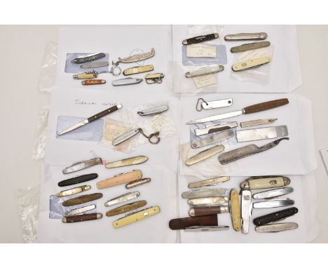 AN ASSORTMENT OF KNIVES, a large selection of small pocket knives, also including a razor and surgical knife