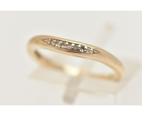 A 9CT GOLD DIAMOND SET RING, polished band set with a small row of seven single cut diamonds, hallmarked 9ct London, ring siz