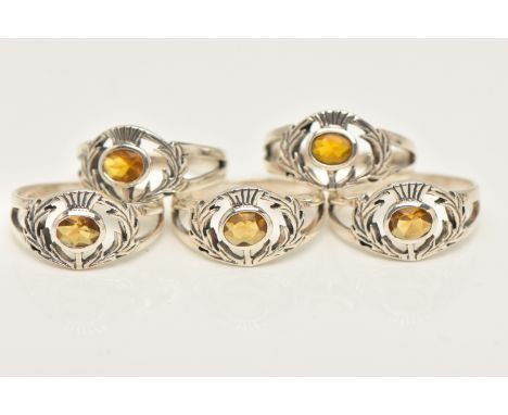 FIVE WHITE METAL GEM SET RINGS, thistle design each set with an oval cut orange paste, each stamped 925, ring sizes K, approx