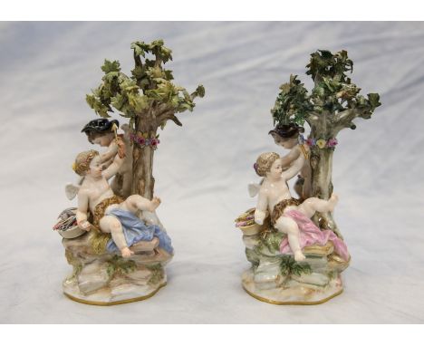 2 Meissen figurines, cherubs with trees, one missing hand, one with broken stick, 8" h