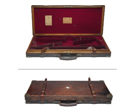 JAMES PURDEY &amp; SONS A BRASS-CORNERED OAK AND LEATHER DOUBLE GUNCASE, fitted for 29in. 12-bore side by side barrels, the i
