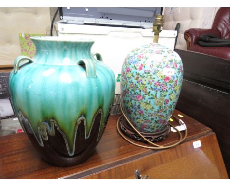 CHINESE STYLE LAMP ON CARVED WOODEN STAND (NO PLUG), AND AN OVOID GLAZED POTTERY VASE