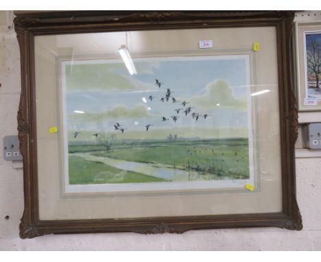 FRAMED AND GLAZED PRINT OF A GEESE IN FLIGHT, AFTER PETER SCOTT, SIGNED IN PENCIL