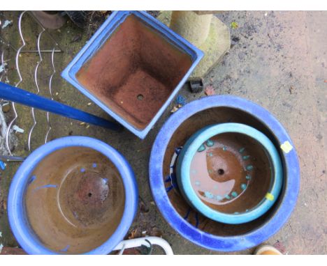 THREE BLUE GLAZE CIRCULAR PLANTERS AND A SQUARE BLUE GLAZE PLANTER
